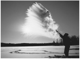 Hot water is vaporizing as it is thrown into air that is −37.2°C (−35°F).