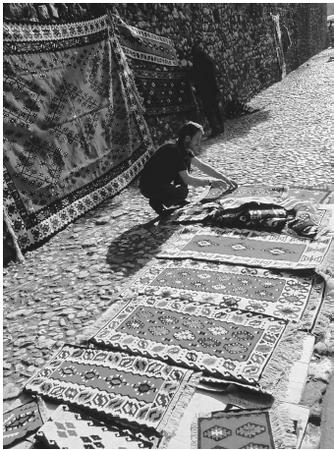 A carpet trader in Sarajevo, Bosnia and Herzegovina. Wool fibers are refined to produce high-quality fabrics for numerous commercial purposes.