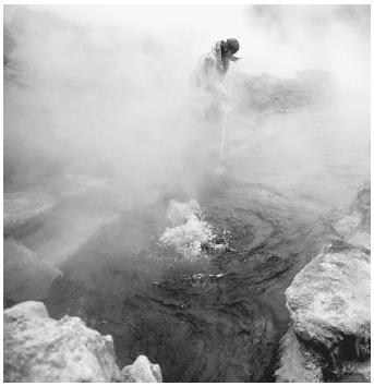 A scientist studying helium being released from a hot spring in Yellowstone National Park.