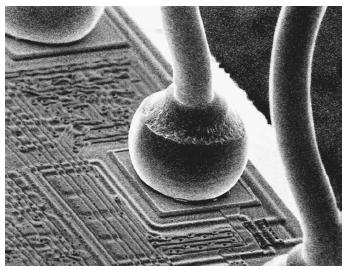 Micro-wires bonded on a silicon chip.